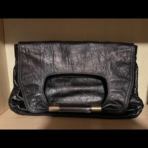 Chloe Clutch pre owned with Chloe on glass handles. Black leather 9x14